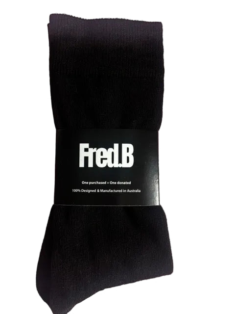 Black sock with a 'Fred.B' label on a pink background