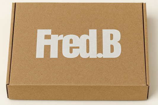 Brown cardboard box with 'Fred.B' printed on it against a white background
